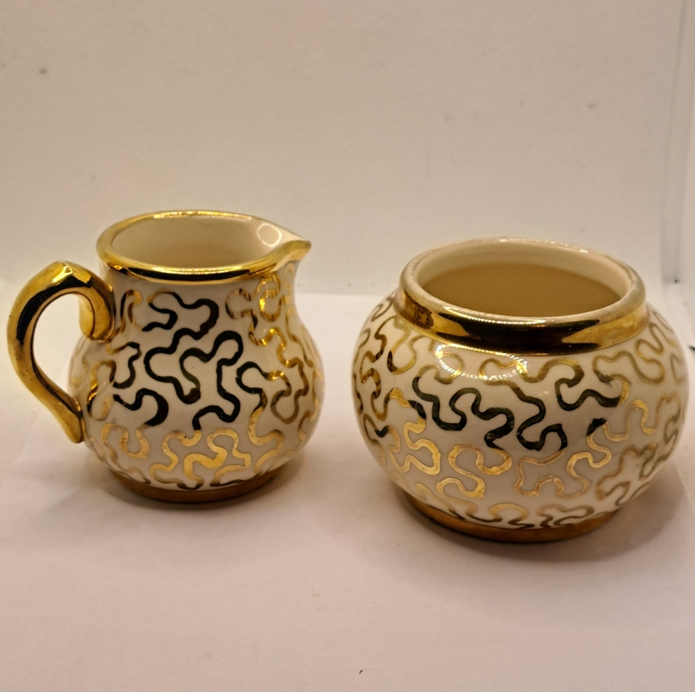 Sudlow's creamer and open sugar bowl. Gold squiggle pattern. Made in England